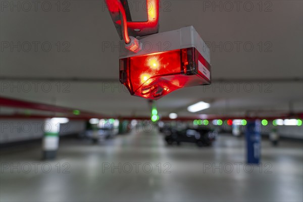 Underground car parks, multi-storey car parks, red or green lamps on the ceiling, show drivers whether a parking space is free or occupied, and thus also measure the utilisation of the parking space and indicate at the entrances where there are still how many free parking spaces North Rhine-Westphalia, Germany, Europe