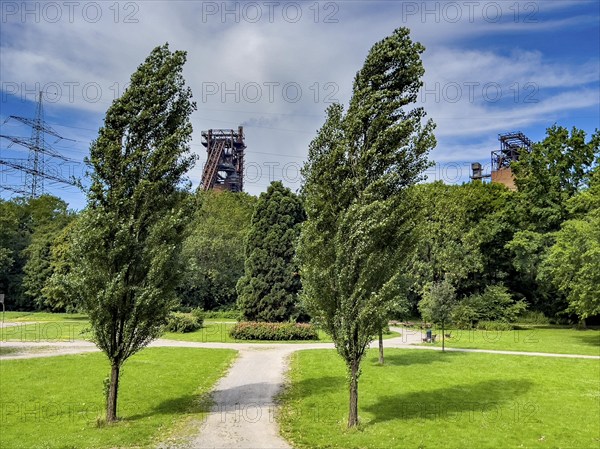 The Volkspark Schwelgern in Duisburg Marxloh, from 1925, municipal park donated by August Thyssen, directly adjacent to the high courtyards of the Thyssenkrupp Steel Marxloh steelworks, Duisburg, North Rhine-Westphalia, Germany, Europe