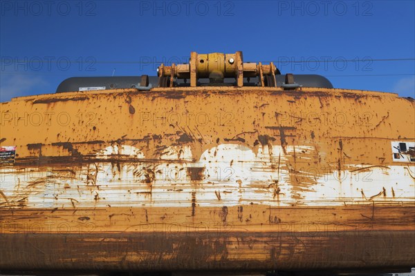 Rusted back end of yellow painted backhoe excavator, Quebec, Canada, North America