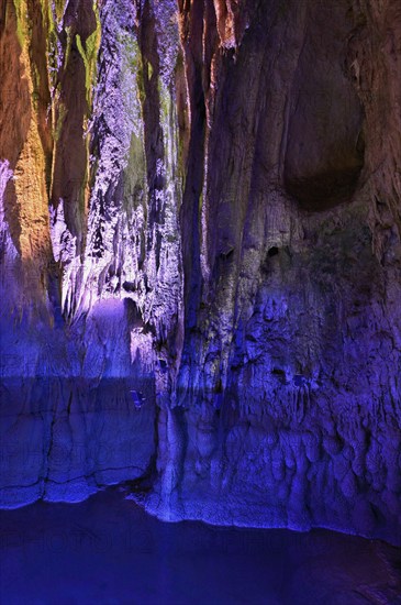 Stalactites illuminated by coloured light, stalactite cave, Höllgrotten, Baar, Canton Zug, Switzerland, Europe