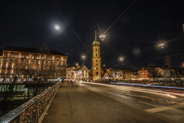 Christmas illuminated Mur bridge, behind Frnziskanerkirche, light trails, night shot, Graz, Styria, Austria, Europe