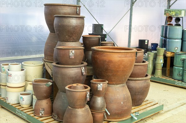 Earthenware natural clay frost proof planter pots made by Woodlodge at Swanns Nursery garden centre, Suffolk, England, UK