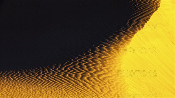 Wind-sculpted sand structure in the Rub al Khali desert, Dhofar province, Arabian Peninsula, Sultanate of Oman