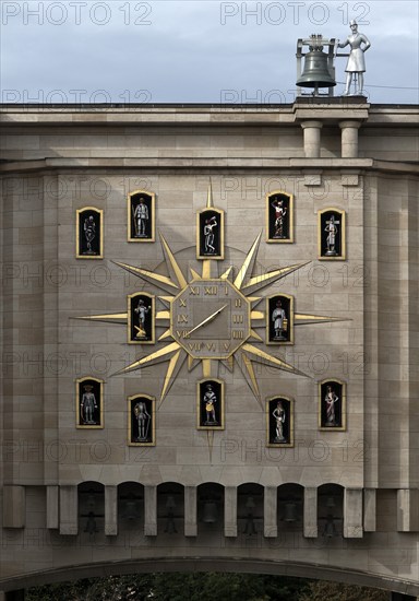 Large golden wall clock with twelve figures at the back of the Dynasty Palace, Brussels, Belgium, Europe