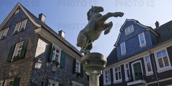 Horse fountain by Rudolf Christian Baisch in front of the town history centre, Mettmann, Bergisches Land, North Rhine-Westphalia, Germany, Europe