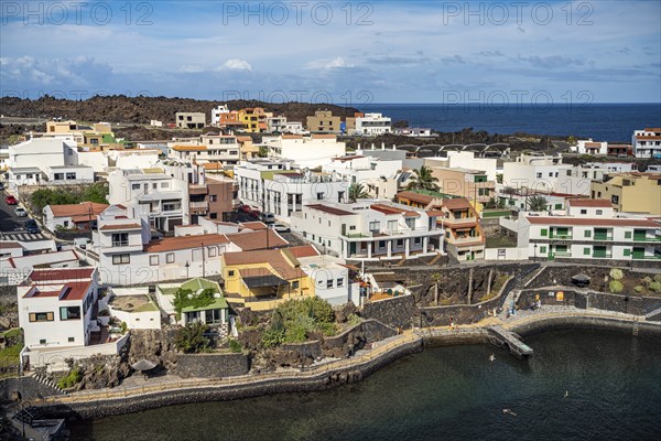 View from the Mirador El Tamaduste of the natural swimming pool and the village of Tamaduste, El Hierro, Canary Islands, Spain, Europe