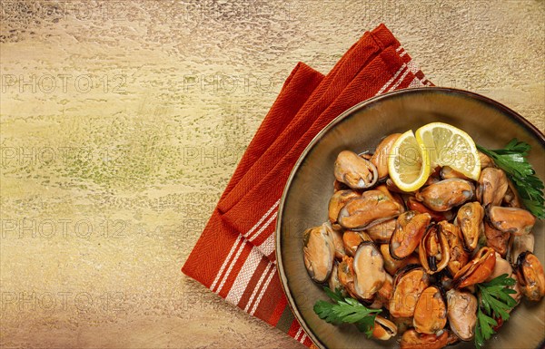 Mussels no shell, boiled, mussels, peeled, in a bowl, with lemon and parsley, Chilean mussels, top view, no people
