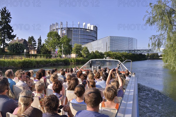 Excursion boat with tourists in front of the buildings of the European Parliament, Strasbourg, Département Bas-Rhin, Alsace, France, Europe