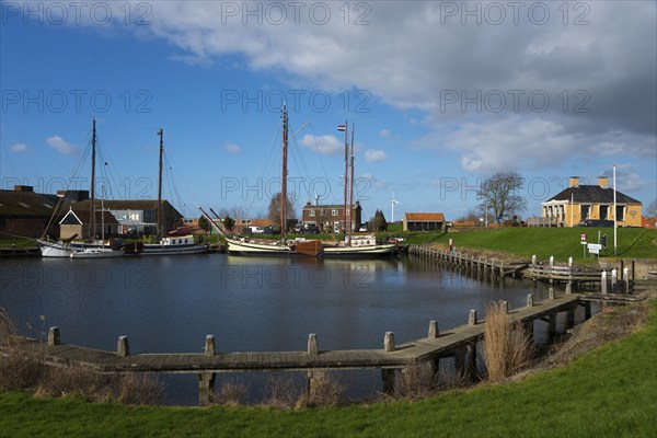 Ships in the harbour at Workum lock, Workum, Friesland, Fryslân, Netherlands