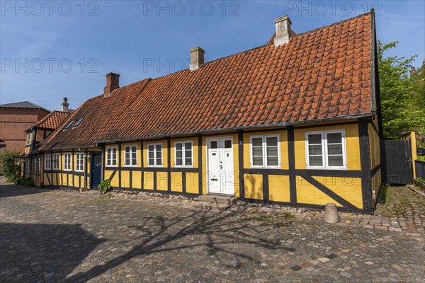 Svendborg Old Town, yellow half-timbered house, door, red roof tiles, chimneys, cobblestones, Fyn, Fyn Island, Denmark, Europe