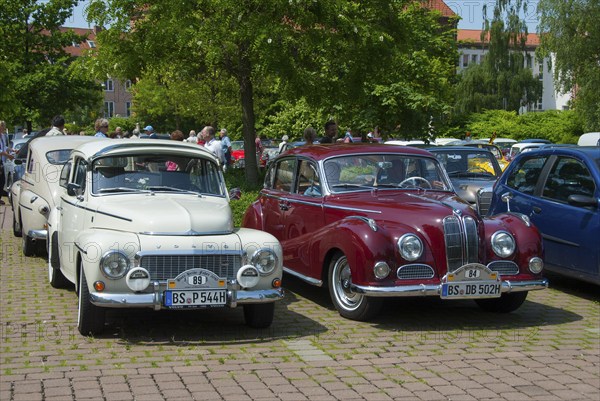 Two vintage cars, one red and one white, parked next to each other, vintage car, Volvo PV 544, 1964, and BMW 502, 2600 L, 1962, Lower Saxony, Germany, Europe