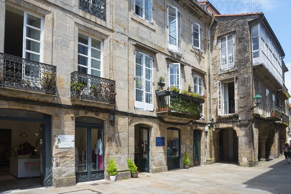 Narrow old town street lined with stone buildings with balconies, Rua Nova, Santiago de Compostela, autonomous community of Galicia, place of pilgrimage, destination of the Way of St James, Spain, Europe