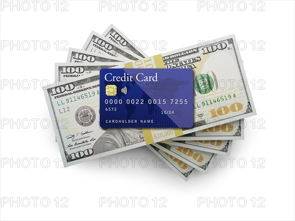 Fifty thousand dollars stack of one hundred dollar bills with a credit card on top isolated on a white background