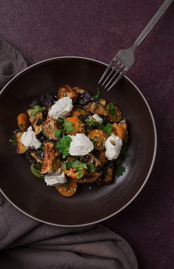 Warm Salad with crispy eggplant and tomatoes, cottage cheese, spices, herbs, sesame seeds, sunflower seeds, Georgian cuisine, no people