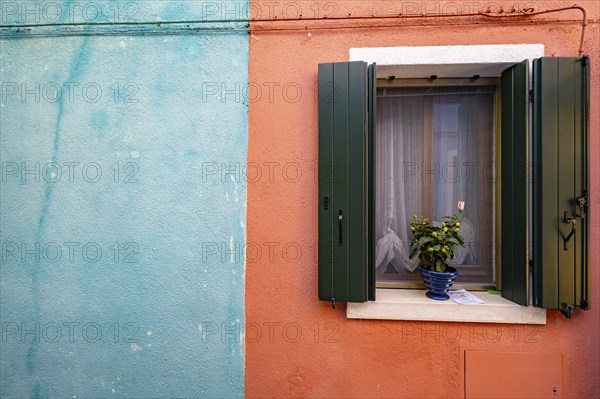 Blue and red house facade with windows, colourful houses on the island of Burano, Venice, Veneto, Italy, Europe