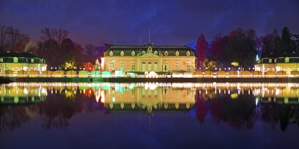 Illuminated Benrath Palace with wing building in the evening at Christmas Wunderwelt, Düsseldorf, North Rhine-Westphalia, Germany, Europe