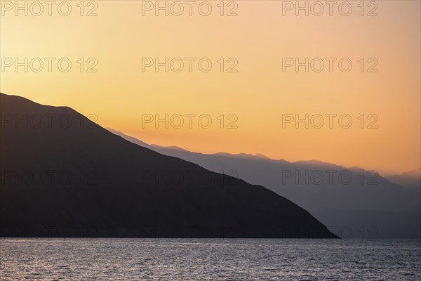 Lake and mountain landscape at sunset, Toktogul reservoir, Jalalabad region, Kyrgyzstan, Asia