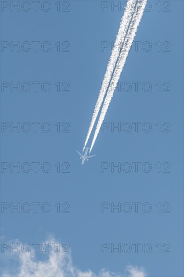 Airliners in flight in a blue sky in late summer. France