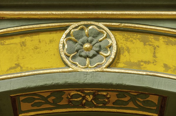 Decorative details on the frame of the medieval entrance portal at the New Town Hall of Freiburg im Breisgau, Baden-Württemberg, Germany, Europe