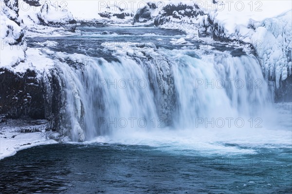 Godafoss waterfall, icy and snowy rock face, Northern Iceland Eyestra, Iceland, Europe