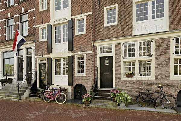 Bicycles in front of historic buildings, Herengracht 43, Amsterdam, Province of North Holland, Netherlands