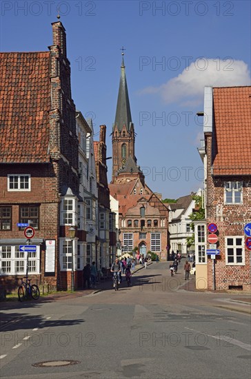 Europe, Germany, Lower Saxony, Hamburg Metropolitan Region, Lüneburg, View from the Tor Tor to the Old Town, Tower of St. Nicolai, Cyclist, Europe