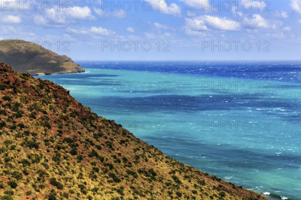 Mirador de La Amatista with view of rocky coast and turquoise sea, coastline at La Isleta, sunny weather, typical light mood, Almeria, Cabo de Gata, Cabo de Gata-Nijar, Spain, Europe