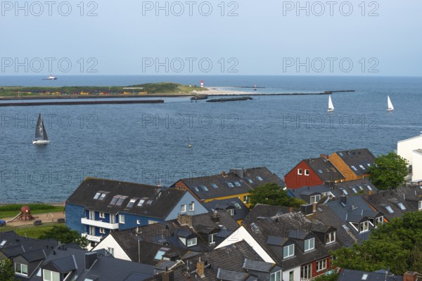 View from the upper land over houses in the lower land to the Helgoland dune, offshore island Helgoland, sailing boats, lighthouse, North Sea, district Pinneberg, Schleswig-Holstein, Germany, Europe