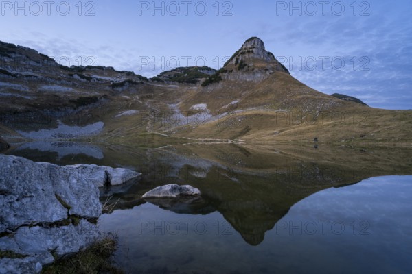 Lake Augstsee and the Atterkogel mountain on the Loser. Autumn, good weather, blue sky. In the evening after sunset. Reflection. Altaussee, Bad Aussee, Ausseer Land, Totes Gebirge, Styria, Upper Austria, Austria, Europe