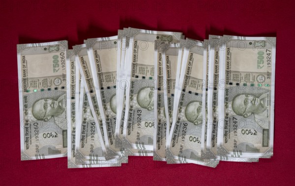 Indian 500 rupee currency bank note on a red background