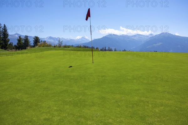 Crans Sur Sierre Golf Course with Hole 7 and Mountain View in Crans Montana in Valais, Switzerland, Europe