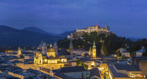 Night view of Salzburg with illuminated historical buildings and the Hohensalzburg Fortress in the background, Salzburg, Salzburger Land, Austria, Europe