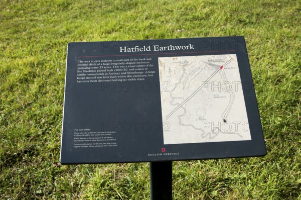 English Heritage information board for the Neolithic Hatfield earthwork site at Marden, Wiltshire, England, United Kingdom, Europe