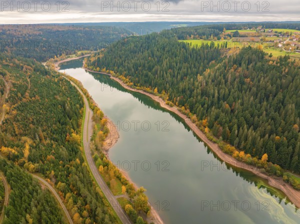 Panoramic view of a river in a wooded region with colourful autumn landscape and roads, Nagoldtalsperre, Black Forest, Germany, Europe
