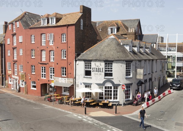 Old historic buildings on quayside at Poole harbour, Poole, Dorset, England, UK