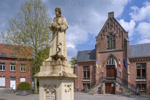 Statue of Gabriel Mudeus on the town square and former city hall in neo-Gothic style in the municipality Brecht, Antwerp Province, Flanders, Belgium, Europe
