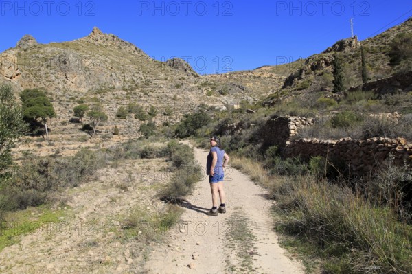 Woman walking in Sierra Alhamilla mountains, Nijar, Almeria, Spain, Europe