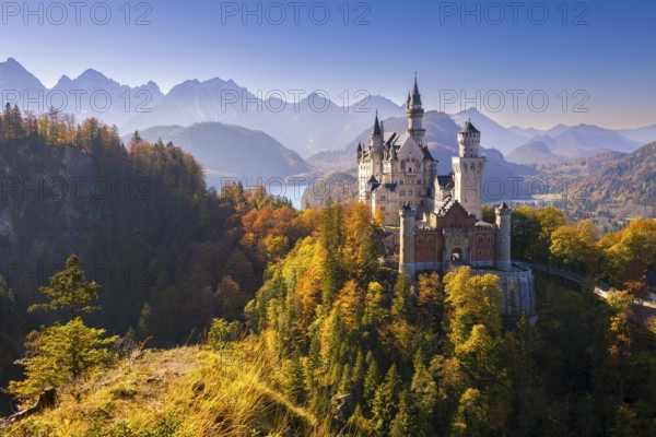 Neuschwanstein Castle in autumnal surroundings, surrounded by mountains, Schwangau, Ostallgäu, Allgäu, Swabia, Upper Bavaria, Bavaria, Germany, Europe