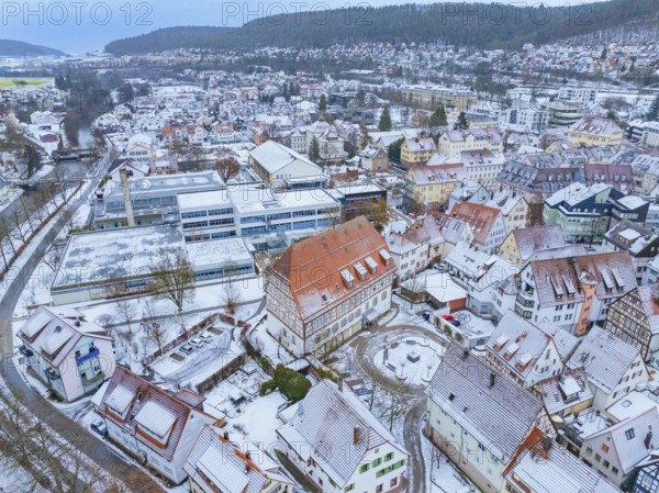Snow-covered residential buildings in an extensive urban landscape, Nagold, Black Forest, Germany, Europe