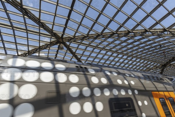 Local train and glass roof at Cologne Central Station, Cologne, Rhineland, North Rhine-Westphalia, Germany, Europe