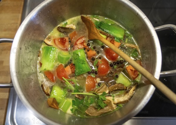 Vegetable soup, or vegetable stock, is cooked with various vegetables, which are slowly simmered with herbs and spices, later strained out, leaving behind a vegetable stock, vegetable stock for further processing, for soups, sauces, etc