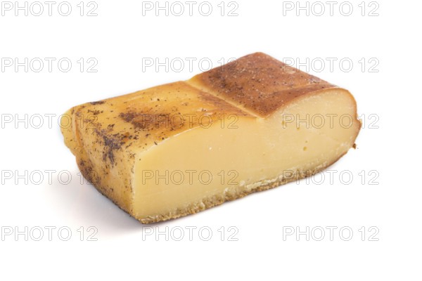 Piece of smoked cheese isolated on white background. Side view, close up