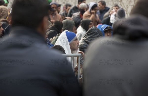 Refugees from Syria waiting to be registered at the Central Reception Centre for Asylum Seekers at the Berlin State Office for Health and Social Affairs, 09.10.2015