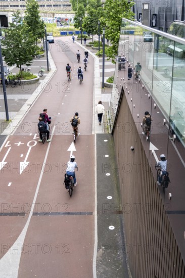 Entrance and exit of the bicycle car park at Utrecht Centraal station, Stationsplein, over 13, 000 parking spaces, considered the largest bicycle car park in the world, over 3 underground floors, Utrecht, Netherlands