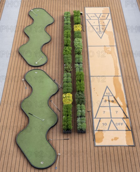 Outdoor deck, upper deck, open-air deck of a river cruise ship, putting green and shuffleboard game on deck
