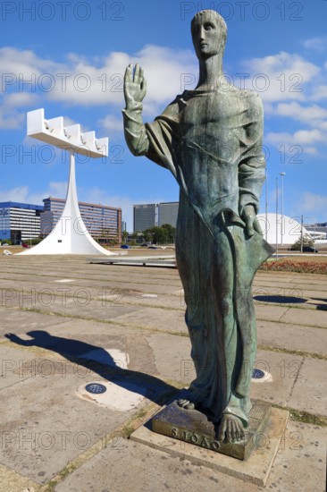St John the Evangelist statue by Alfredo Ceschiatti and Dante Croce in front of the bell tower of Roman Cathedral of Brasília or Metropolitan Cathedral, designed by Oscar Niemeyer, World Heritage Site, Brasilia, Federal district, Brazil, South America