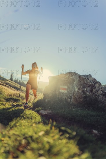 Summer trail running and hiking in the Alps on the Riedberg Pass between Obermaiselstein and Balderschwang in the Allgäu, Bavaria, Germany, Europe