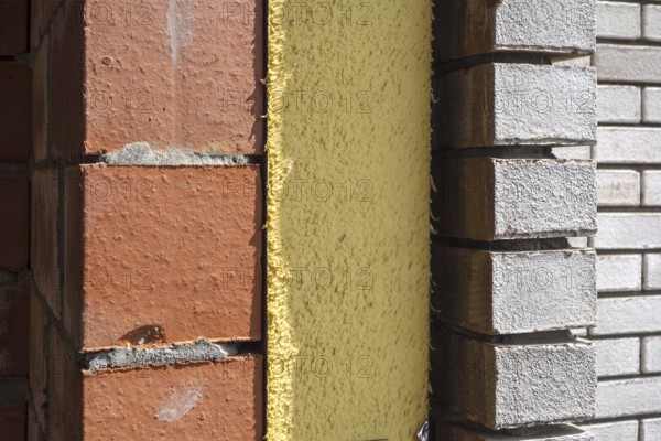 Close up of cavity wall insulation boards fitted in masonry cavities in newly built house used to reduce heat loss