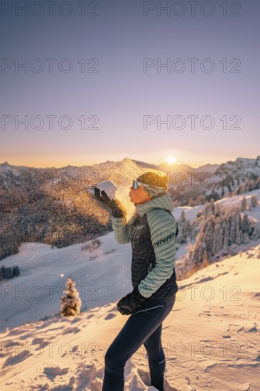 Summit bliss in the snow-covered winter landscape in the Tannheimer Tal in the Alps on the Neunerköpfle, Tyrol, Austria, Europe