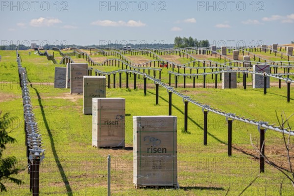 Albion, Michigan, Construction of a solar farm by AES Corporation. Boxes of solar panels from Risen Energy, a Chinese company, await installation